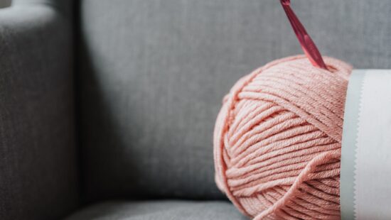yarn for knitting on sofa at home